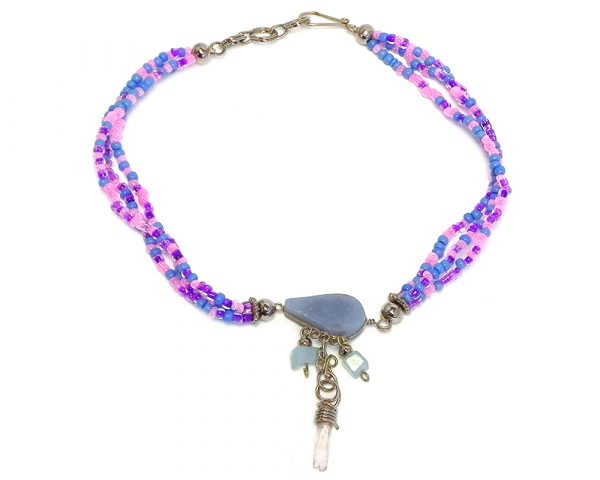 Handmade seed bead multi strand anklet with teardrop-cut angelite stone and natural clear quartz crystal and chip stone dangles in light blue, pink, and purple color combination.