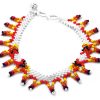 Handmade Native American inspired Czech glass seed bead anklet with V-shaped beaded fringe dangles in white and fire red, orange, yellow, and black color combination.