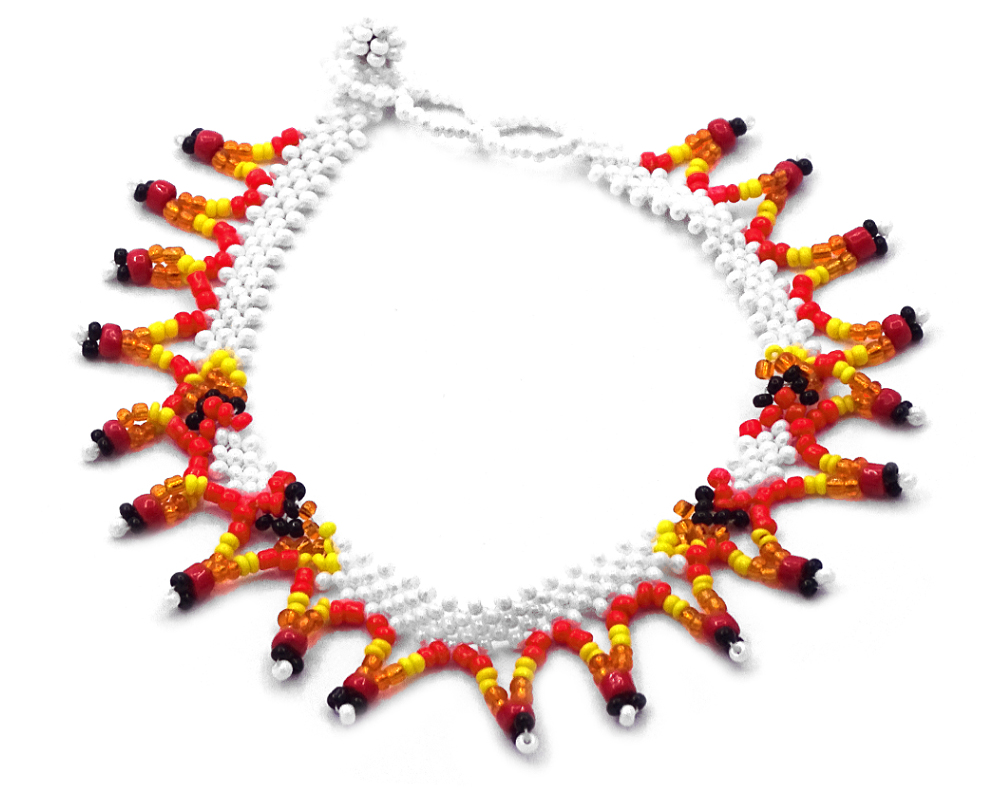 Handmade Native American inspired Czech glass seed bead anklet with V-shaped beaded fringe dangles in white and fire red, orange, yellow, and black color combination.