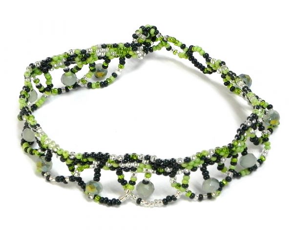 Handmade Czech glass seed bead and crystal bead anklet with multicolored pattern design and beaded loop fringe dangles in green, lime green, and silver color combination.