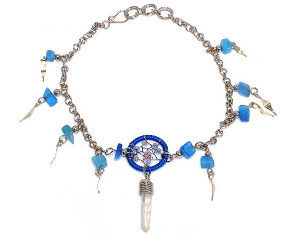 Handmade alpaca silver metal chain anklet with round beaded thread dream catcher, natural clear quartz crystal point, chip stones, and metal dangles in blue and light blue color combination.