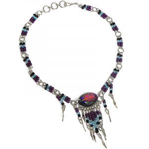 Handmade seed bead alpaca silver metal chain anklet with oval-shaped acrylic New Age themed tree of life graphic design and long beaded metal dangles in purple, light blue, black, and multicolored color combination.