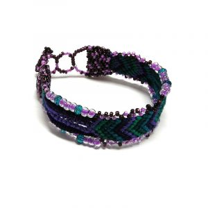 Handmade thick woven braided macramé wide strap bracelet with Czech glass seed beads and crystal beads in purple, magenta pink, burgundy, green, and teal color combination.