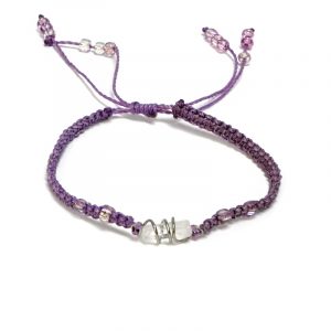 Handmade macramé braided string pull tie bracelet with silver metal wire wrapped clear quartz crystal centerpiece in purple lavender color.