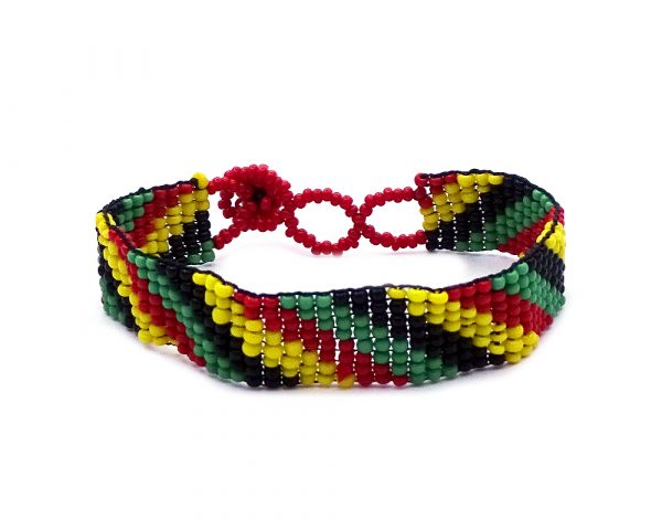 Handmade Czech glass seed bead thin strap bracelet with matte slanted striped pattern design in Rasta colors.