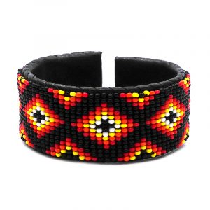 Handmade Native American inspired Czech glass seed bead black leather cuff bracelet with tribal fire diamond pattern design in black, red, orange, yellow, and white color combination.
