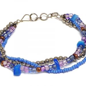 Handmade large seed bead and silver metal bead thick multi strand bracelet with chip stones in light blue and purple lavender color combination.