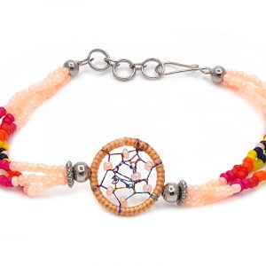 Handmade native American inspired multicolored seed bead multi strand bracelet with round beaded thread dream catcher centerpiece in peach, dark pink, red, orange, yellow, and black color combination.