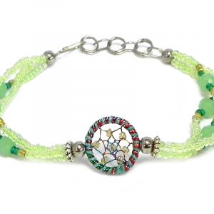 Handmade seed bead and crystal bead multi strand bracelet with round beaded sparkle thread dream catcher centerpiece in light green, mint, green, and gold color combination.