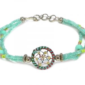 Handmade seed bead and crystal bead multi strand bracelet with round beaded sparkle thread dream catcher centerpiece in mint green, lime green, and gold color combination.