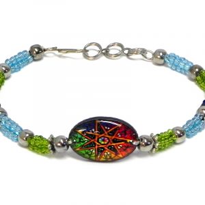 Handmade seed bead and silver metal bead rope-like bracelet with oval-shaped acrylic New Age themed mandala star graphic design centerpiece in gold, rainbow, lime green, light blue, and iridescent navy blue color combination.