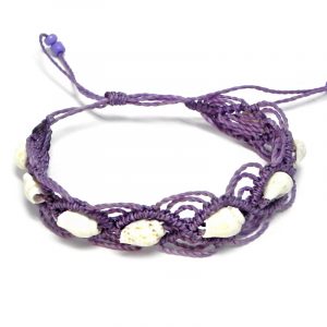 Handmade macramé braided string pull tie bracelet with multiple natural seashells in purple lavender color.