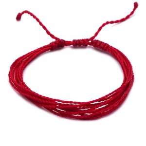 Handmade multi strand string pull tie bracelet in solid red color.