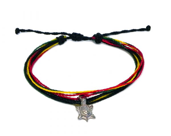 Handmade multistrand string pull tie bracelet with silver metal sea turtle charm dangle in Rasta colors.