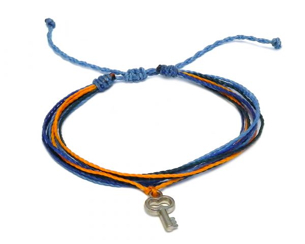 Handmade multicolored multi strand string pull tie bracelet with silver metal key charm dangle in light blue, blue, orange, and teal green color combination.