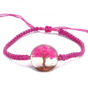 Handmade macramé braided string pull tie bracelet with round-shaped clear acrylic resin, copper wire, and crushed chip stone inlay tree of life centerpiece in pink color.