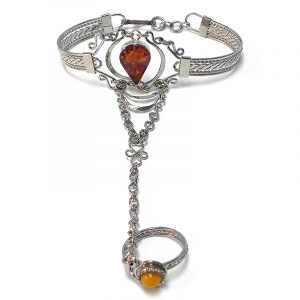 Handmade alpaca silver metal cuff harem bracelet with teardrop-shaped resin and crushed chip stone inlay cabochon centerpiece, chain linked to mini round bead ring in tan orange color.