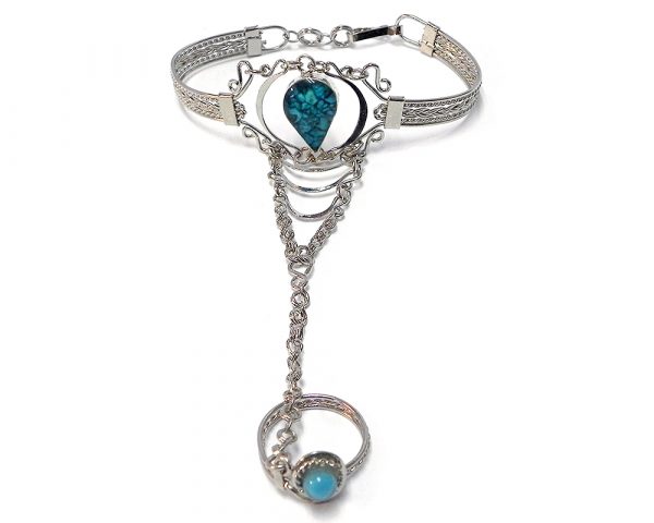 Handmade alpaca silver metal cuff harem bracelet with teardrop-shaped resin and crushed chip stone inlay cabochon centerpiece, chain linked to mini round bead ring in turquoise blue color.