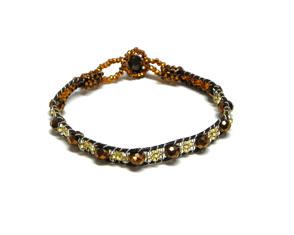 Handmade Czech glass seed bead and crystal bead thin strap bracelet in brown, dark brown, and gold color combination.
