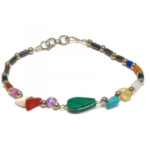 Handmade hematite, multicolored chip stone, and silver metal seed bead bracelet with teardrop-cut gemstone cabochon centerpiece in green malachite.