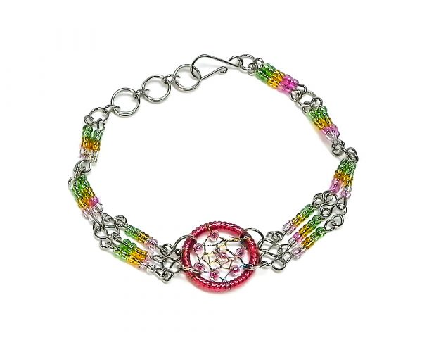Handmade multicolored seed bead silver metal chain bracelet with round beaded thread dream catcher centerpiece in pink, golden yellow, and lime green color combination.
