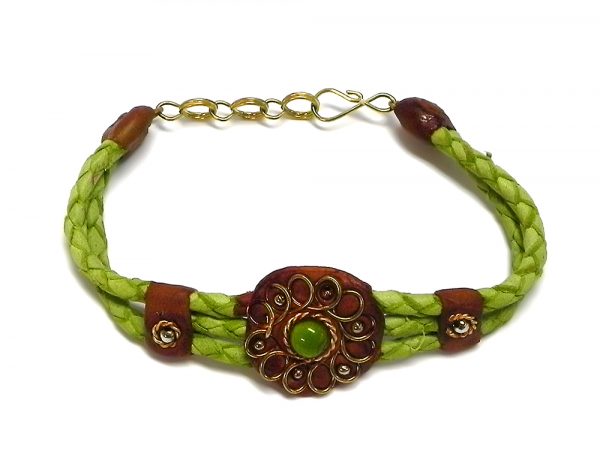 Handmade braided dyed leather bracelet with brown resin, gold-colored metal wire flower design, and single bead centerpiece in lime green color.