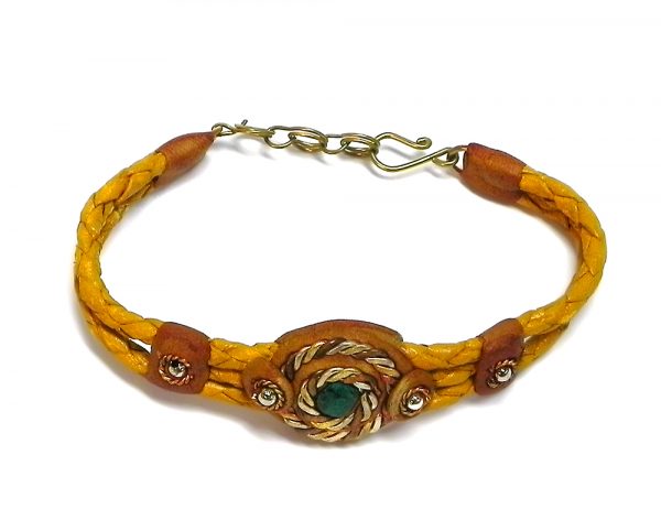 Handmade braided dyed leather bracelet with brown resin, mixed metal spiral design, and mini round teal green chrysocolla stone cabochon centerpiece in golden yellow-orange color.