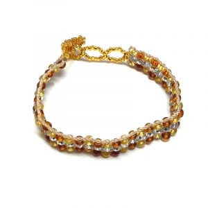 Handmade Czech glass seed bead and crystal bead strap bracelet in gold, beige, and silver color combination.