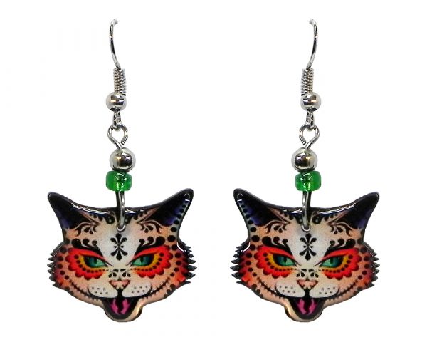 Tribal pattern sugar skull cat face acrylic dangle earrings with beaded metal hooks in orange, green, and black color combination.