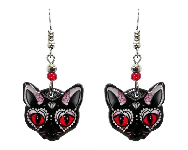 Diamond Day of the Dead sugar skull pattern cat face acrylic dangle earrings with beaded metal hooks in black, white, red, and pink color combination.