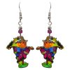 Halloween themed scarecrow acrylic dangle earrings with beaded metal hooks in orange, purple, blue, and green.