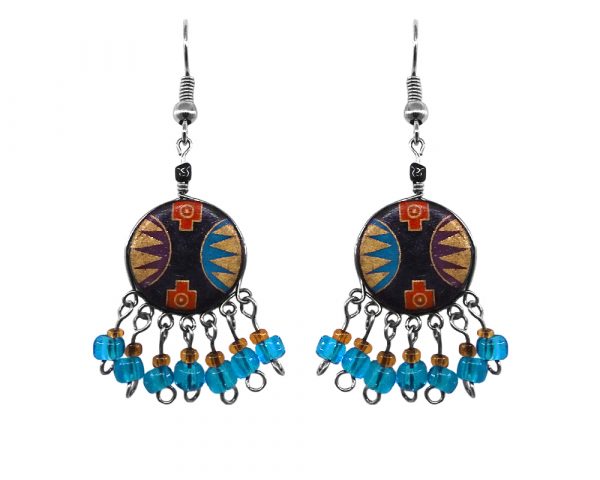 Handmade round-shaped ceramic earrings with handpainted tribal pattern design and short seed bead and alpaca silver metal dangles in turquoise blue, gold, black, red, and dark purple color combination.