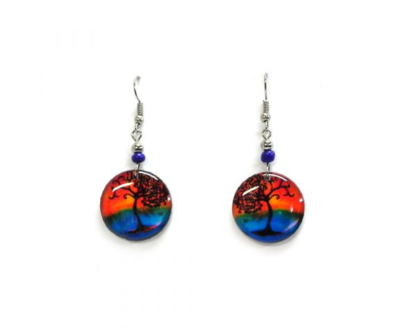 Round-shaped New Age themed sunset tree of life graphic acrylic dangle earrings with beaded metal hooks in orange, blue, and black color combination.