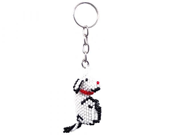 Handmade Czech glass seed bead figurine keychain of a dog in white, black, and red color combination.