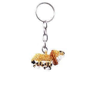 Handmade Czech glass seed bead figurine keychain of a lion in gold, brown, white, and black color combination.