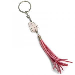 Handmade wire wrapped tumbled gemstone crystal with suede tassel dangle on silver metal key ring in pink color and light pink rose quartz.