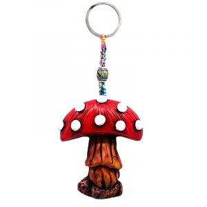 Handmade durepox resin figurine keychain of a toadstool Amanita magic mushroom in red and white color combination.