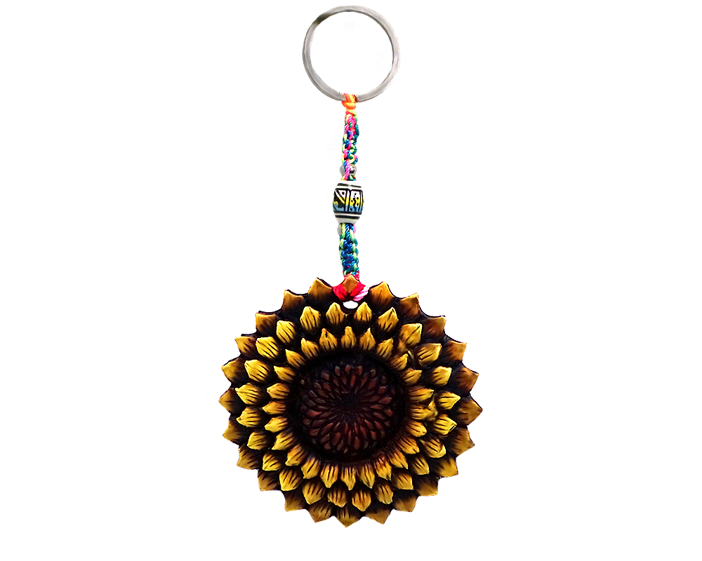 Handmade durepox resin figurine keychain of a sunflower in yellow and brown color combination.