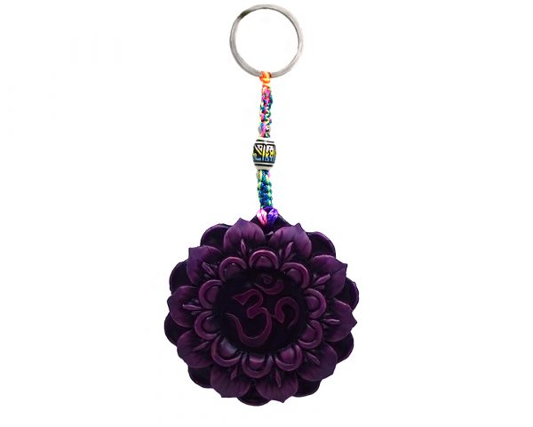 Handmade durepox resin figurine keychain of a Crown chakra symbol, represented by the Om sign and a violet-colored lotus flower.