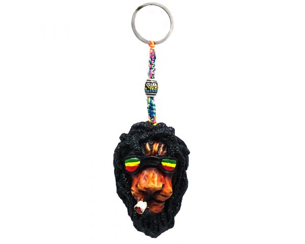 Handmade durepox resin figurine keychain of a smoking lion head with dreaded mane and Rasta-colored sunglasses.