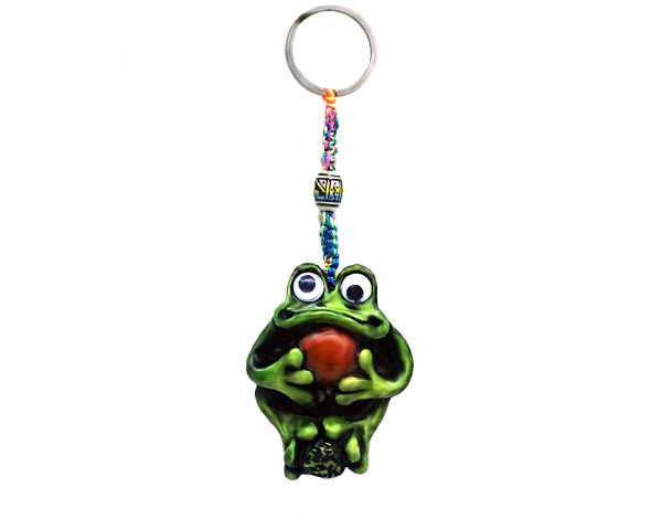 Handmade durepox resin figurine keychain of a green frog with googly eyes holding a stone.