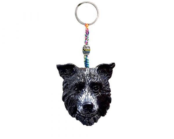 Durepox resin figurine keychain of a black and white Border Collie dog head.