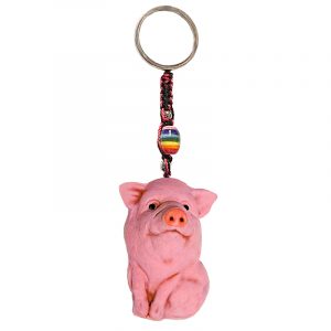 Handmade durepox resin figurine keychain of a pink pig.
