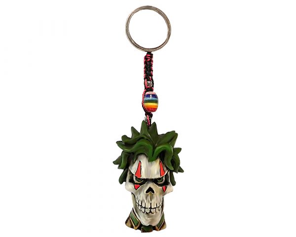 Handmade durepox resin figurine keychain of an evil clown skull with green hair and tie.
