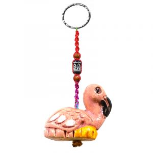 Handmade flamingo animal keychain with handpainted ceramic, macramé string, a large bead, and metal keyring in pink, black, white, and yellow color combination.