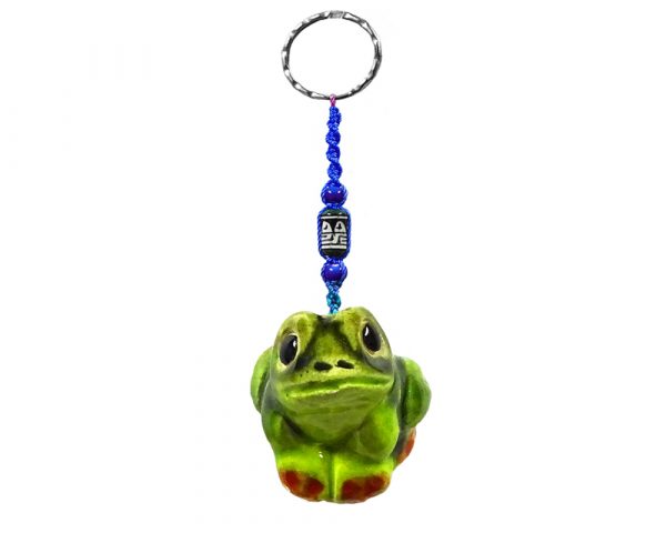 Handmade frog animal keychain with handpainted ceramic, macramé string, a large bead, and metal keyring in green color combination.