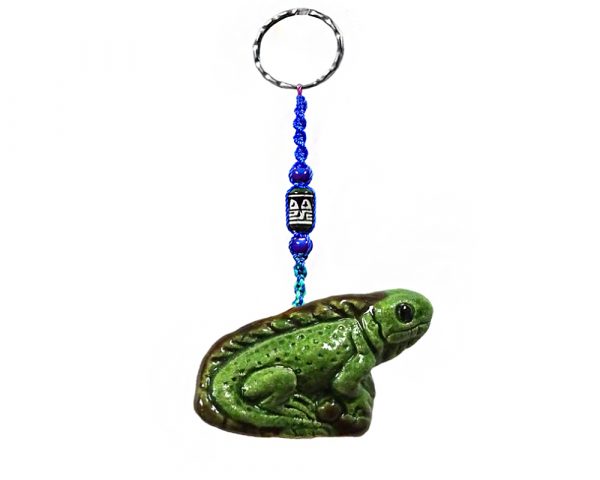 Handmade iguana animal keychain with handpainted ceramic, macramé string, a large bead, and metal keyring in green color combination.