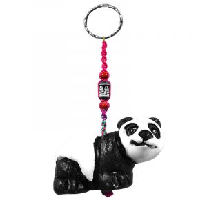 Handmade panda bear animal keychain with handpainted ceramic, macramé string, a large bead, and metal keyring in black and white color combination.