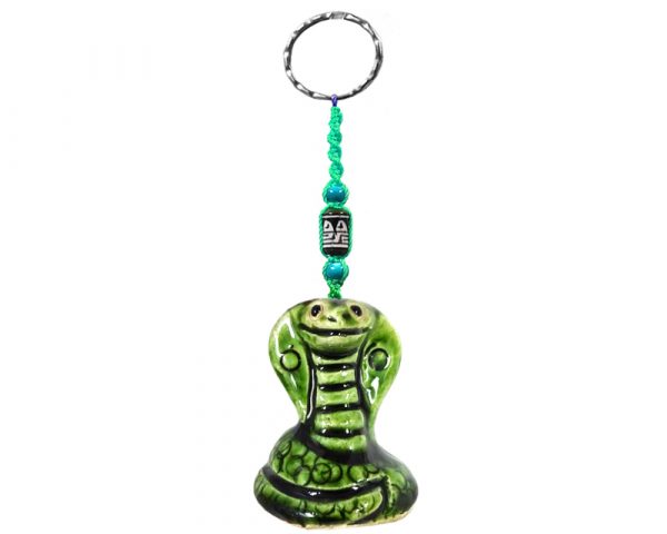 Handmade cobra animal keychain with handpainted ceramic, macramé string, a large bead, and metal keyring in green color combination.