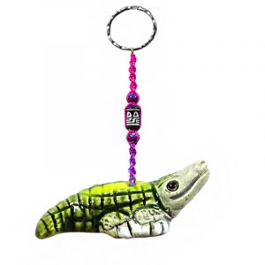 Handmade alligator animal keychain with handpainted ceramic, macramé string, a large bead, and metal keyring in green color combination.